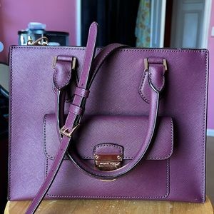 100% Saffiano Leather with gold toned hardware.